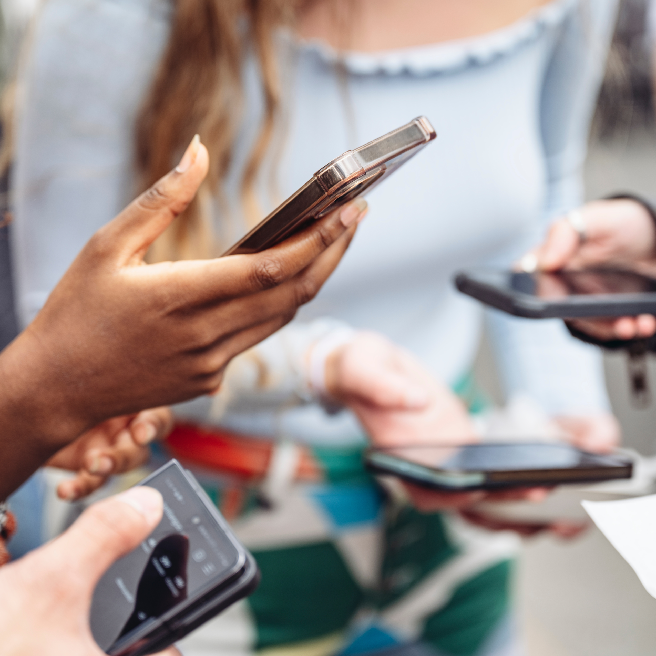 Woman using a mobile phone during a consultation